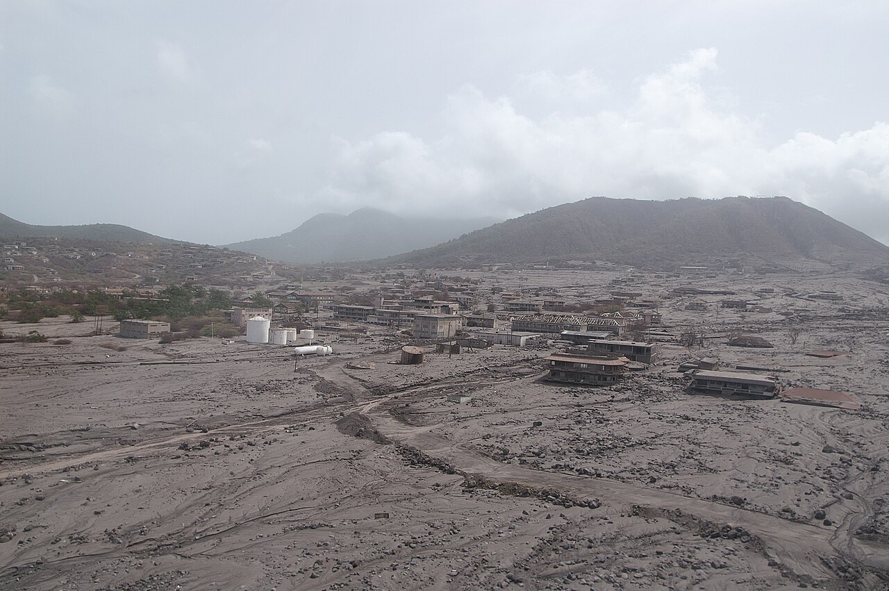 Buildings of Plymouth, Montserrat, partly buried in gray volcanic ash and debris
