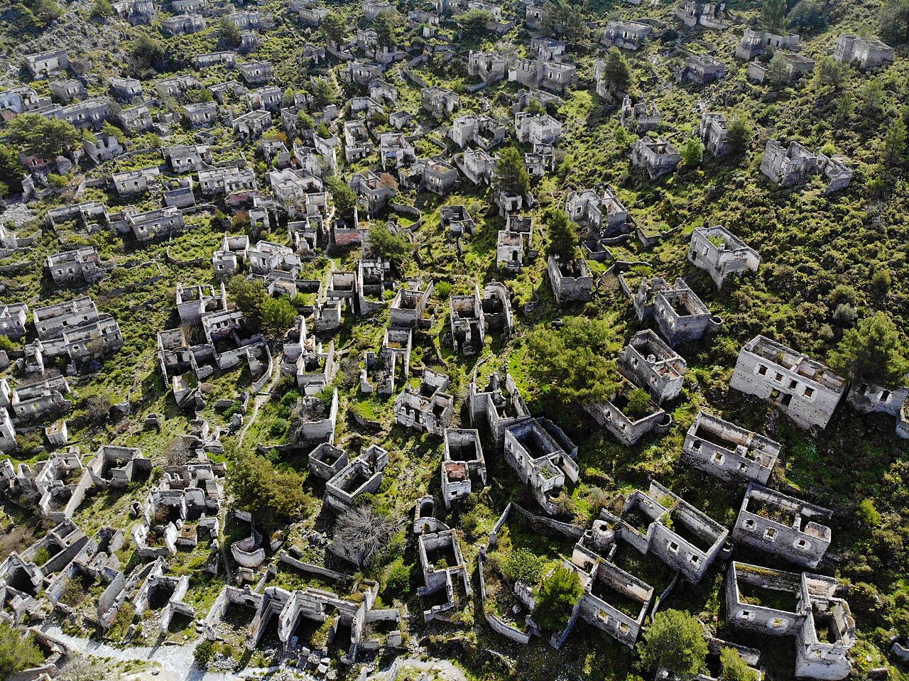 Rows of roofless stone houses covering a hillside in the abandoned village of Kayaköy