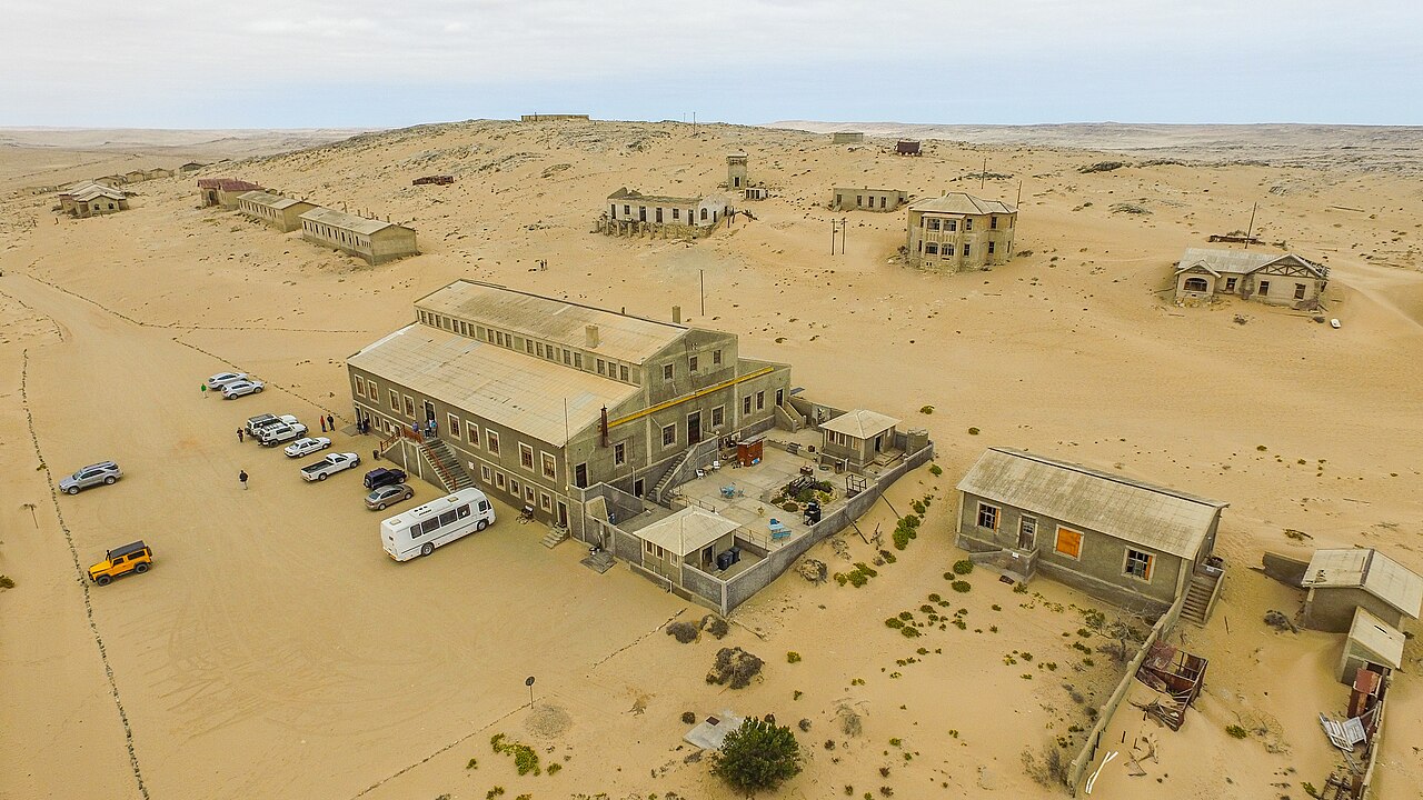 Sand from the Namib Desert piled inside the rooms of an abandoned house in Kolmanskop