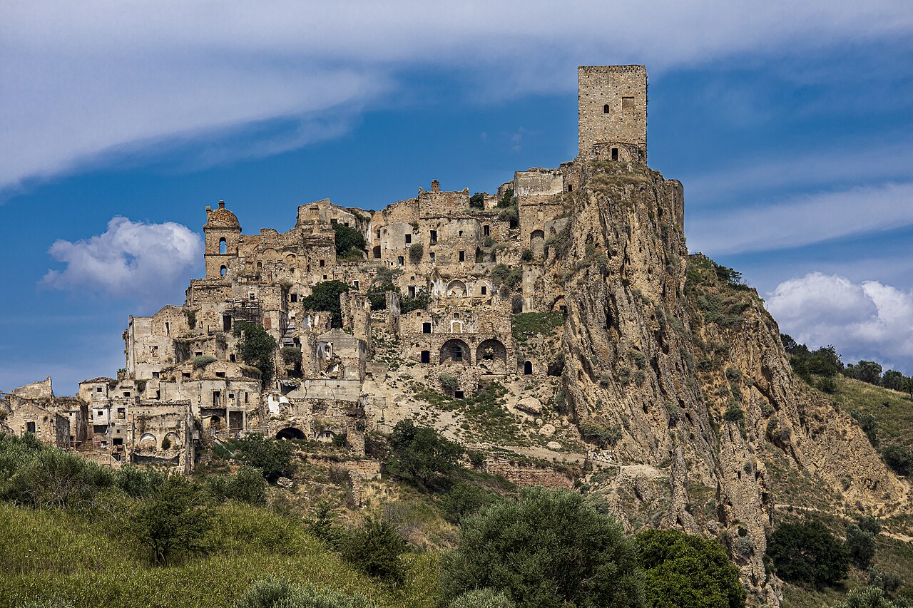 The abandoned hilltop town of Craco, its stone buildings piled around a medieval tower