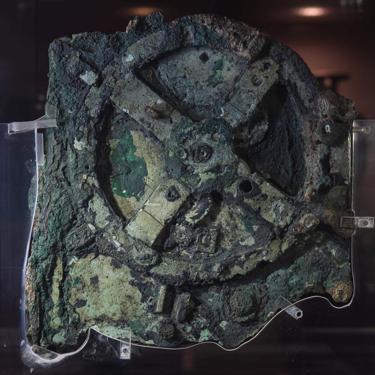 A corroded bronze fragment of the Antikythera mechanism showing its largest gear wheel