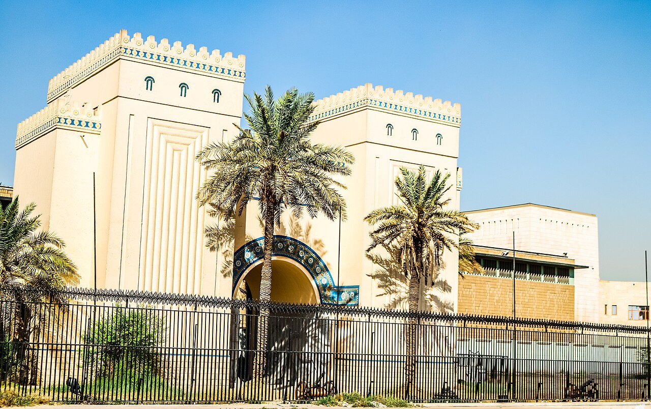 The entrance of the National Museum of Iraq in Baghdad, framed by palm trees