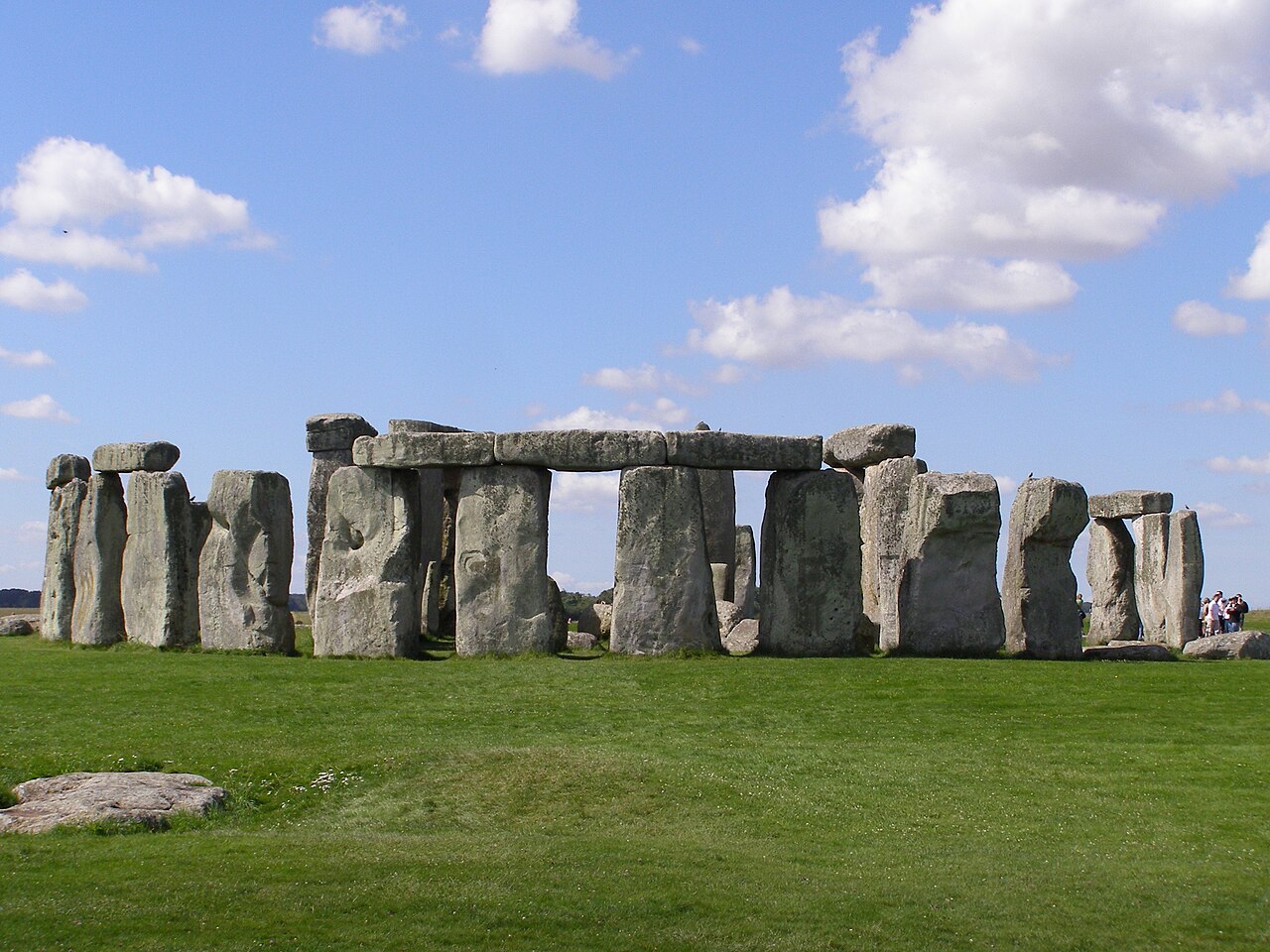 The prehistoric stone circle of Stonehenge standing on open grassland in southern England