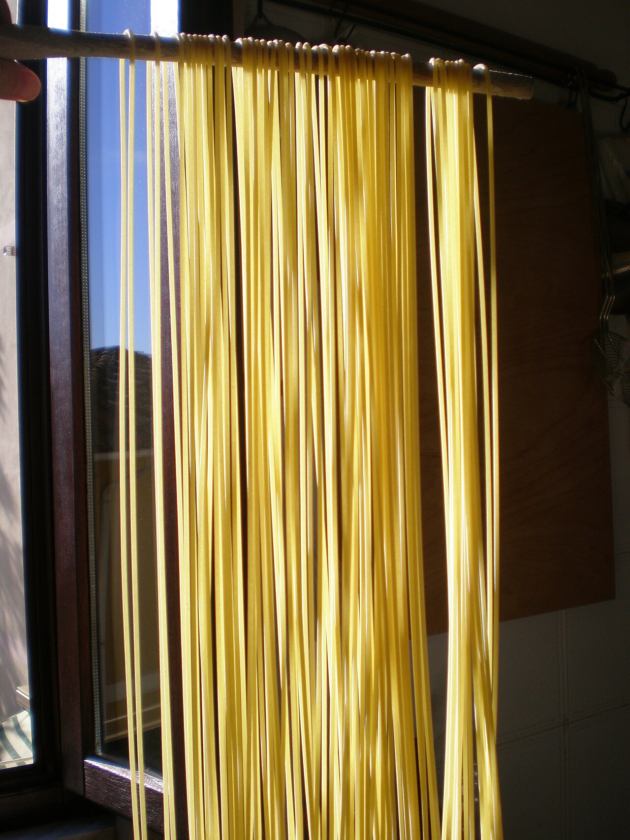 Long, thin strands of spaghetti, the food at the center of a famous TV hoax