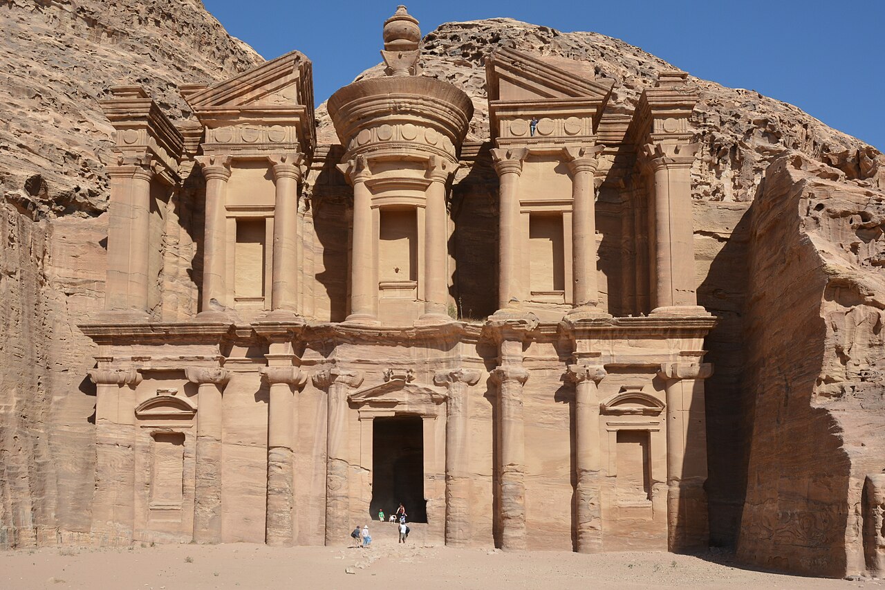 The Treasury, Al-Khazneh, a classical facade carved into a rose-colored cliff at Petra
