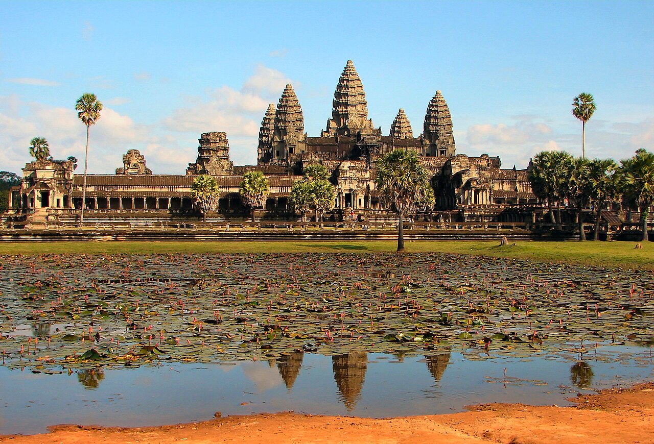 The towers of Angkor Wat temple in Cambodia reflected in a pool in front