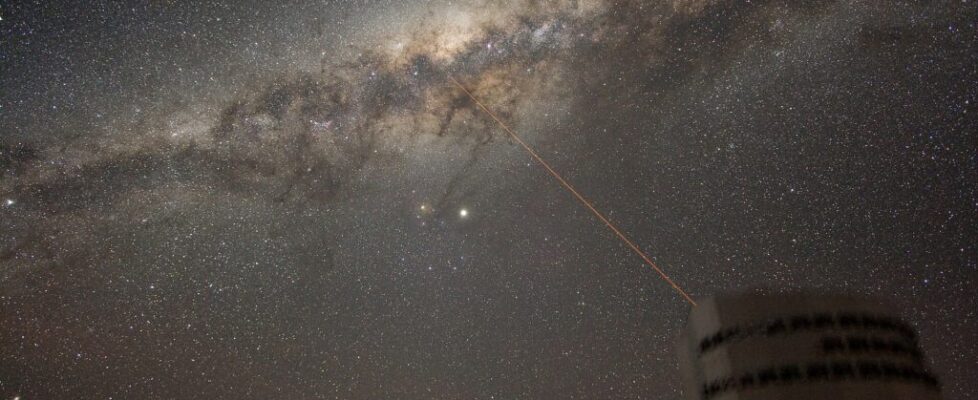The glowing band of the Milky Way stretching across a dark, star-filled night sky