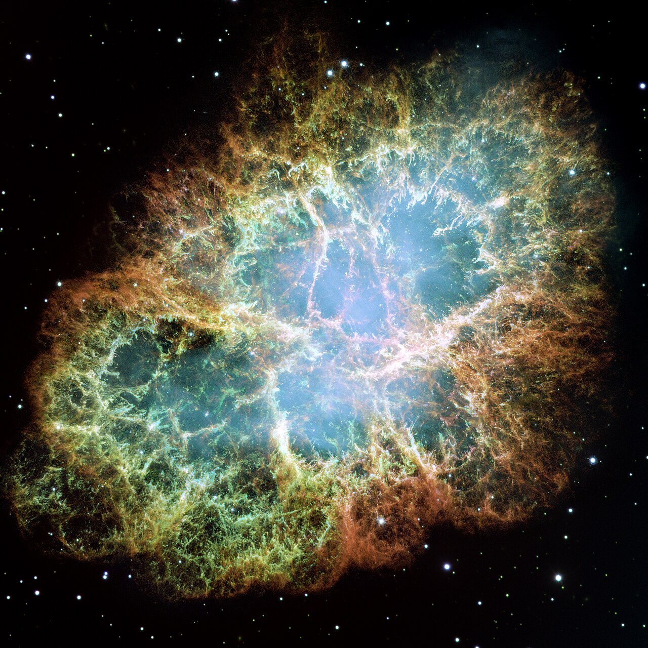 The Crab Nebula, a glowing cloud of supernova debris with a neutron star at its center