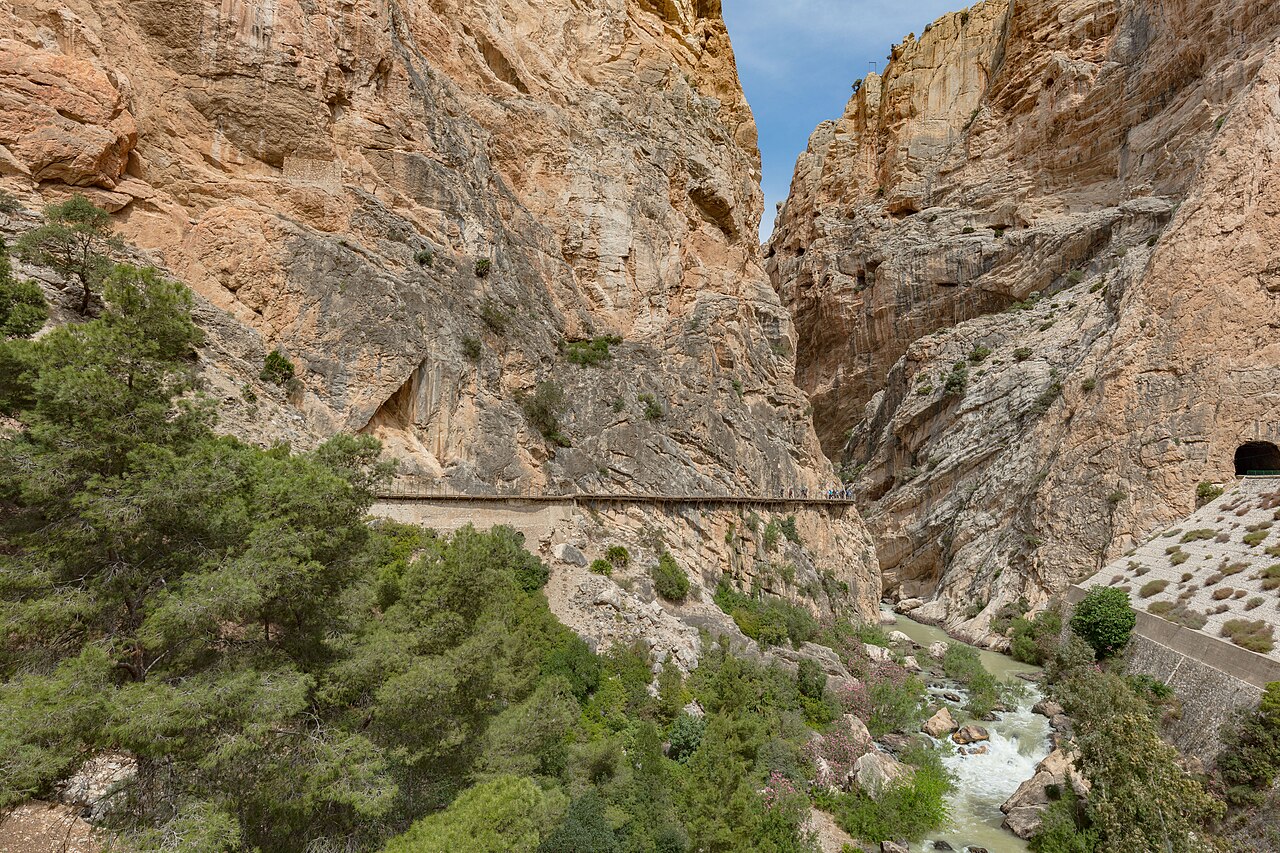 A narrow walkway pinned to the sheer rock wall of the El Chorro gorge in Spain