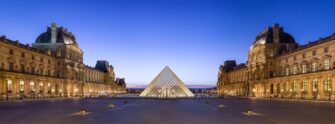 The glass Louvre Pyramid in the main courtyard of the Louvre Museum in Paris