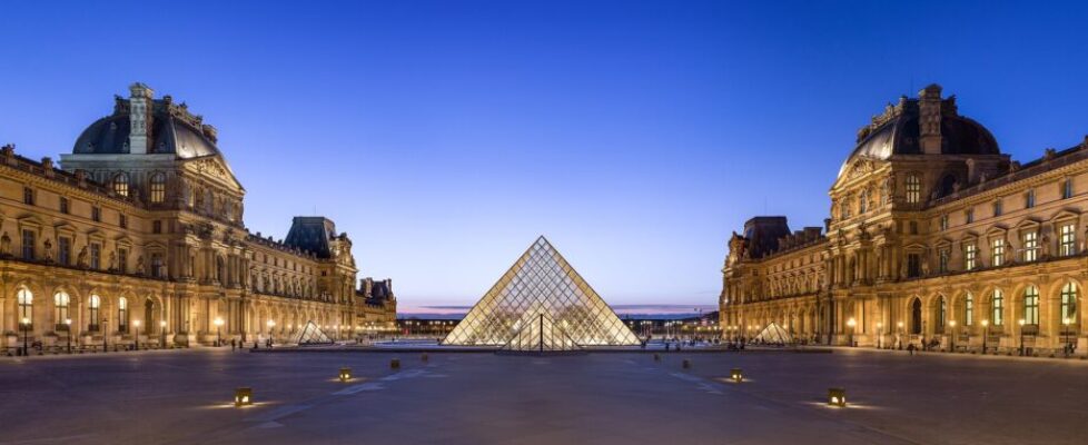 The glass Louvre Pyramid in the main courtyard of the Louvre Museum in Paris