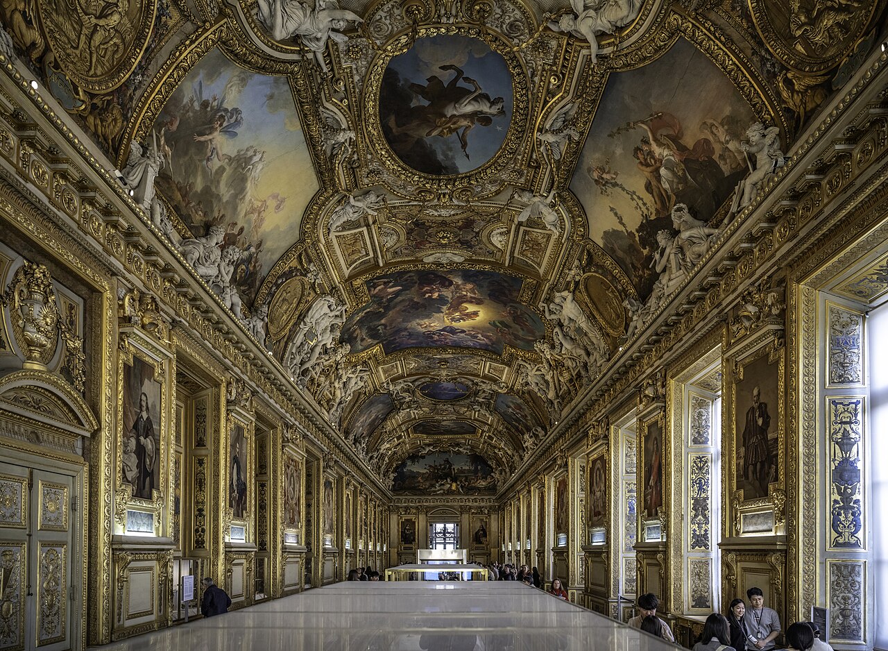The ornate gilded Apollo Gallery with its painted ceiling inside the Louvre Museum in Paris