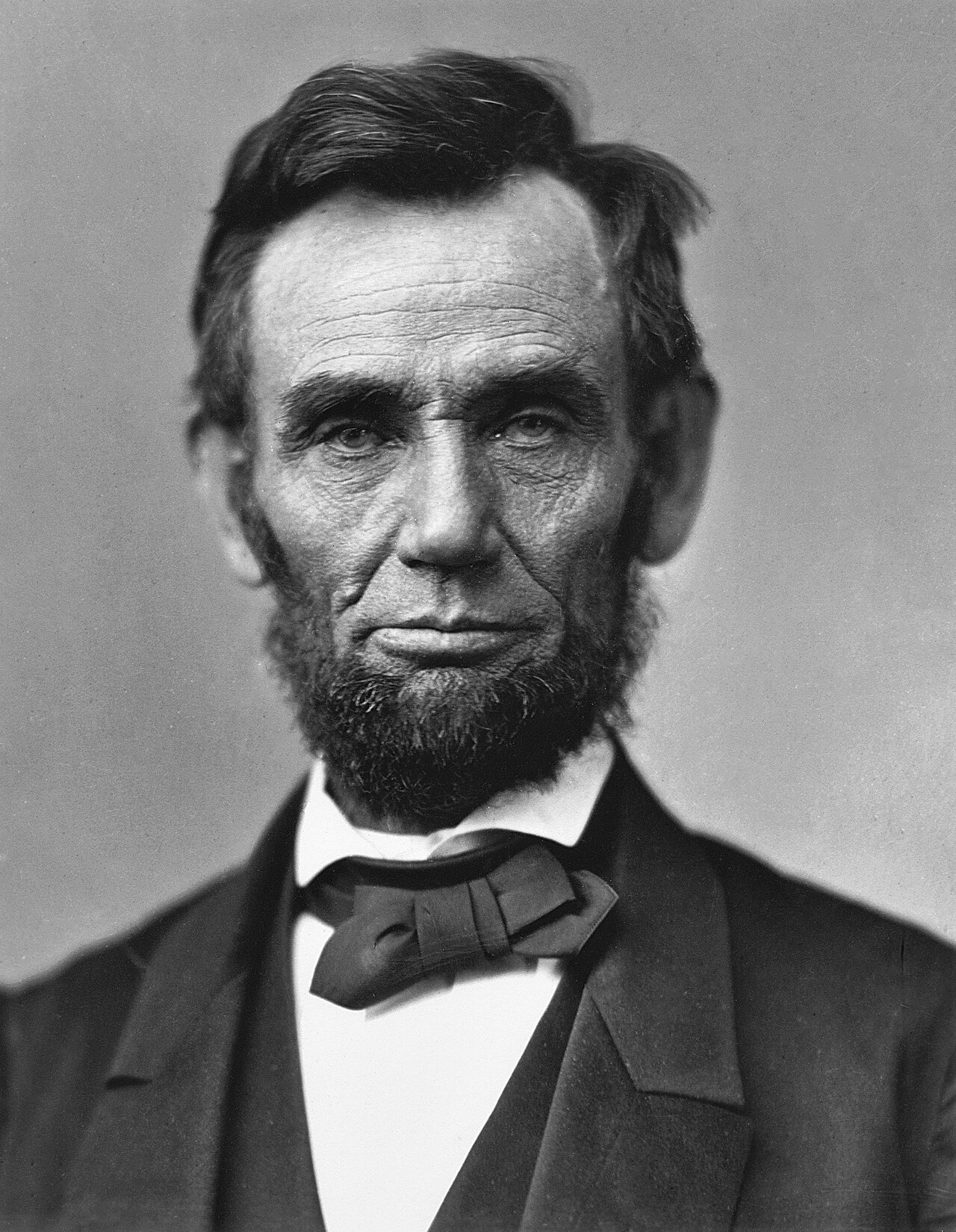 A black-and-white portrait photograph of Abraham Lincoln, the 16th U.S. president