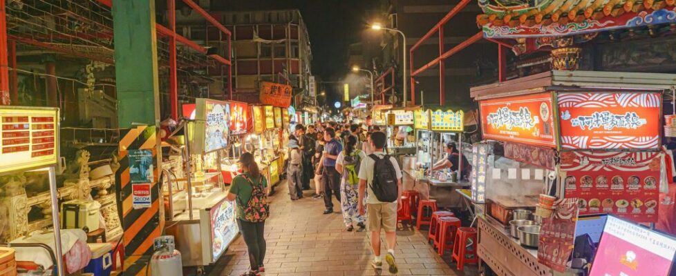 Crowds and brightly lit food stalls at Shilin Night Market in Taipei, Taiwan
